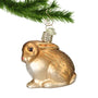 Brown Bunny Glass Ornament hanging by a gold swirl  hook