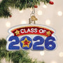 Decorative ornament for 'Class of 2026' hanging on a Christmas tree.