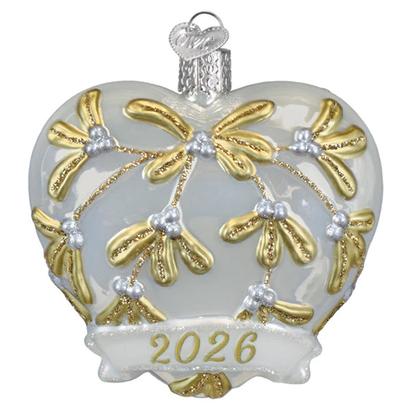 Decorative heart ornament with gold patterns and '2026' on a white background