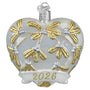 Decorative heart ornament with gold patterns and '2026' on a white background
