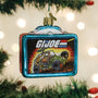 GI Joe Christmas ornament on a tree with blurred lights in the background