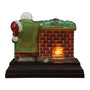Back view of Santa at Hearth Light showing the chair, brick fireplace, and glowing light