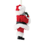 Side view of 2026 Dated Possible Dreams Clothtique Santa Ornament holding a holiday wreath with red 2026 ribbon and faux fur details.