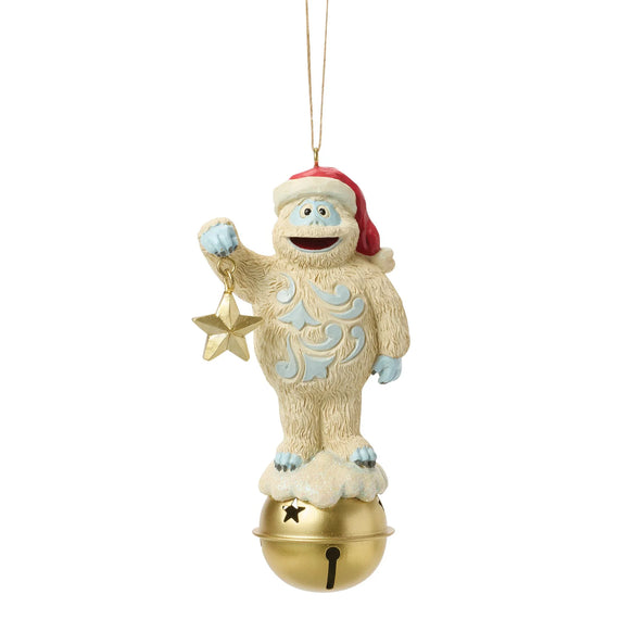 Front view of licensed Bumble on Bell Jim Shore ornament featuring Bumble in a Santa hat holding a gold star while standing on a golden bell.