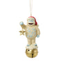 Front view of licensed Bumble on Bell Jim Shore ornament featuring Bumble in a Santa hat holding a gold star while standing on a golden bell.