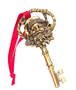 Vintage-style Santa key ornament with a detailed Santa face, gold key design, braided loop, and red hanging ribbon.