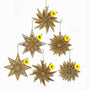 Six gold and silver star-shaped ornaments on a white background sold seperately. 