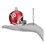 Alabama Red football helmet ornament with number 18 on a hand holding it, showing its size.