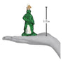 Glass Green Army Man On hand showing size on white background