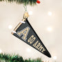 Decorative ornament shaped like a black pennant with 'GO ARMY' text, hanging on a Christmas tree.