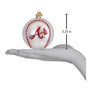 Baseball-shaped ornament with an Atlanta Braves logo, held in a hand to show size, on a white background.