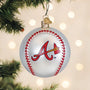 Baseball-shaped ornament with an Atlanta A's logo, hanging on a Christmas tree.