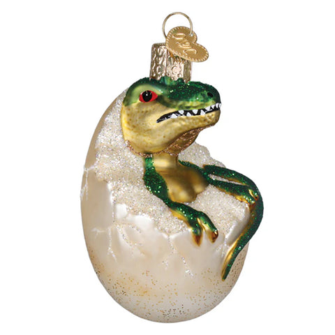 Dinosaur egg ornament with a baby dinosaur emerging on a white background