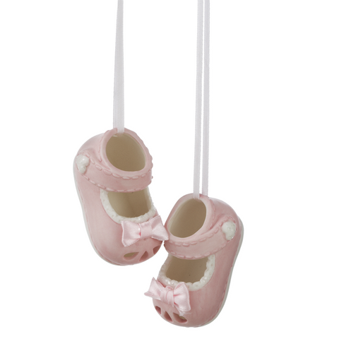 Girl Baby Shoe Ornament Set featuring two pink baby shoes with white trim, small bows, and ribbon hangers.