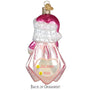 Christmas ornament of a baby Santa with a pink outfit and 'Baby's 1st Christmas' heart, on a white background. Back of ornament