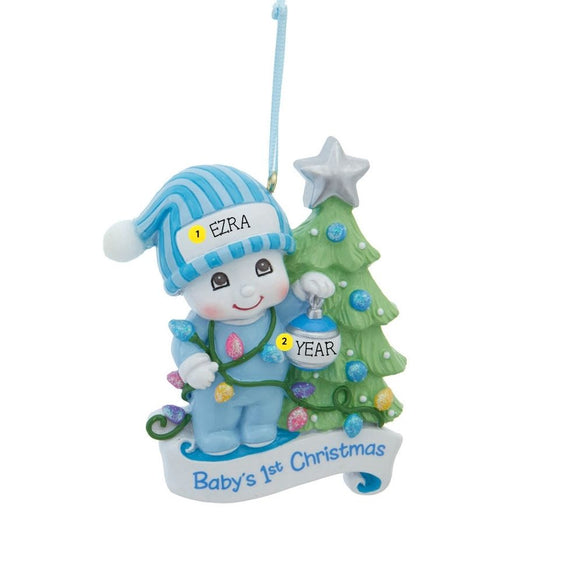 Personalized Baby’s 1st Christmas Snow Kid Ornament - Boy featuring a smiling snow kid in blue pajamas beside a decorated Christmas tree, with space for a name and year. Example Shown