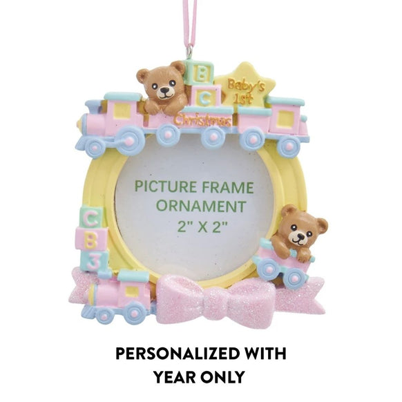 Girl baby’s first Christmas train picture frame ornament with teddy bears, pastel details, 2" x 2" photo opening, and year-only personalization.