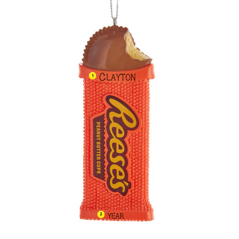 Personalized Reese’s Peanut Butter Cups ornament with orange beaded wrapper, chocolate peanut butter cup, with the example name Clayton and year