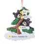 Personalized bear couple ornament with two black bears in a snow-covered evergreen tree and space for two names, a short phrase, and year. Shown with personalizing example. 