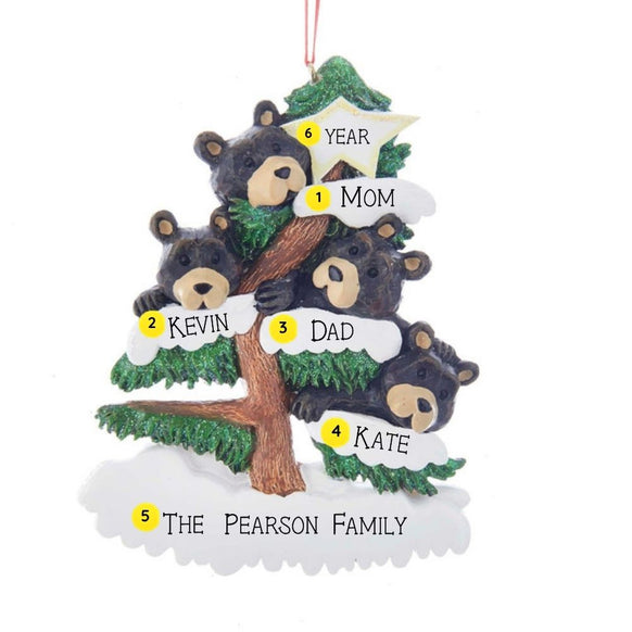 Personalized bear family of 4 ornament with four black bears in a snow-covered evergreen tree and space for four names, a short phrase, and year. Shown with personalization example. 