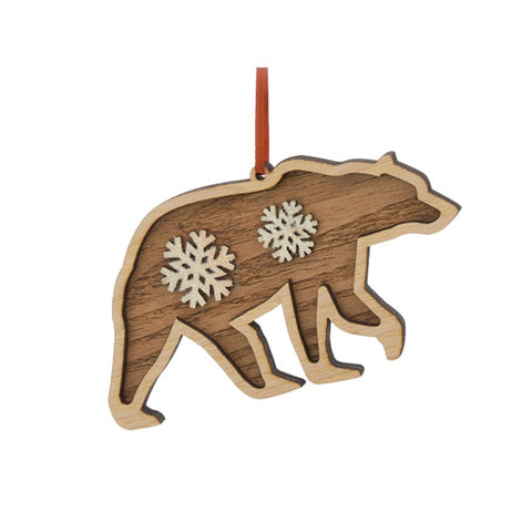 Layered wood bear silhouette ornament with white snowflake accents, natural wood trim, and a red ribbon hanger.
