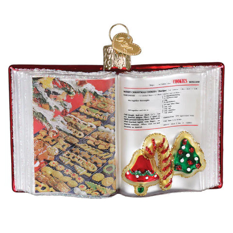 Betty Crocker Cookbook Christmas ornament shaped like an open book with cookies on a white background