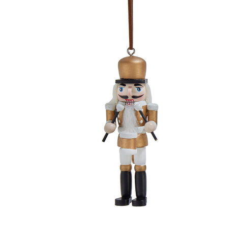 Black, white, and gold nutcracker ornament holding drumsticks, with painted details, a tall hat, and a long white beard.