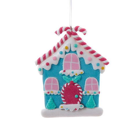 Blue iced candy cottage claydough ornament with pink windows, candy cane roof trim, sprinkle details, tiny trees, and icing-style snow.