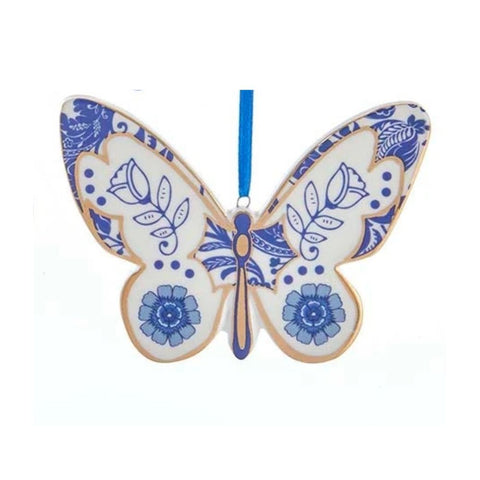 Blue and white butterfly ornament in a Delft-inspired style with rose motifs, floral detailing, and a blue hanging ribbon.