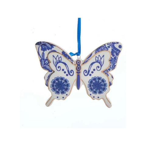 Blue and white butterfly ornament in a Delft-inspired style with wildflower motifs, floral wing details, and a blue hanging ribbon.