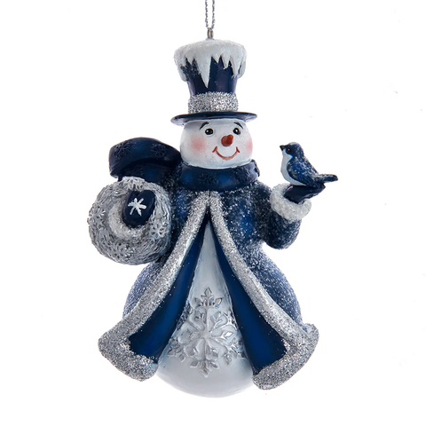 Blue and silver snowman ornament with glittered coat, snowy top hat, silver snowflake details, and a small blue bird perched on one hand.
