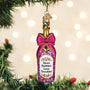 Decorative bottle ornament with a pink bow and 'More Bubbles Less Troubles' text on a Christmas tree.