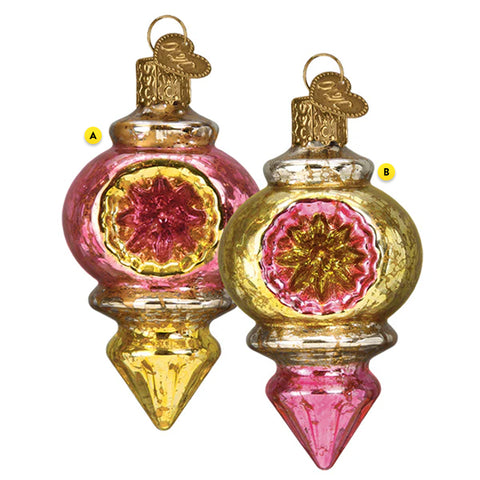 Two ornate glass Christmas ornaments with pink and gold designs on a white background.