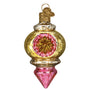 Decorative glass ornament with gold and pink design on a white background
