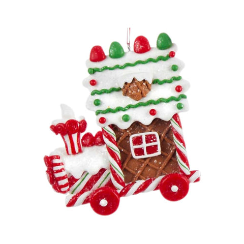 Gingerbread locomotive ornament with white icing, red and green candy accents, candy cane trim, and bright red wheels.