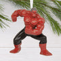 Red Hulk superhero figure ornament on a white background with greenery