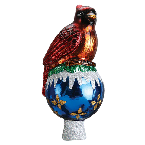 Red cardinal tree topper perched on a shiny blue ornament-shaped base with white snowy accents, gold details, and a silver glittered stem.