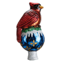 Side view of the Cardinal Tree Topper showing the red bird, blue ornament-shaped base, white snowy trim, and silver glittered stem.