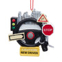Decorative ornament with steering wheel, traffic lights, and signs on a white background