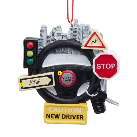 Personalized new driver ornament with a steering wheel, city skyline, traffic light, road signs, car keys, and space for a name and year.