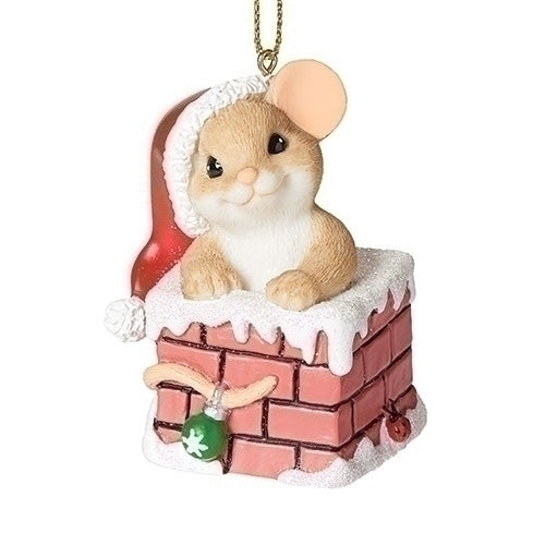Charming Tails Christmas mouse ornament with a tan mouse peeking out of a snowy pink brick chimney beside a red Santa hat.