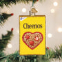 Cheerios cereal box ornament with heart design on a Christmas tree.