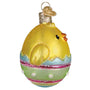 Decorative ornament of a yellow chick in a striped egg on a white background