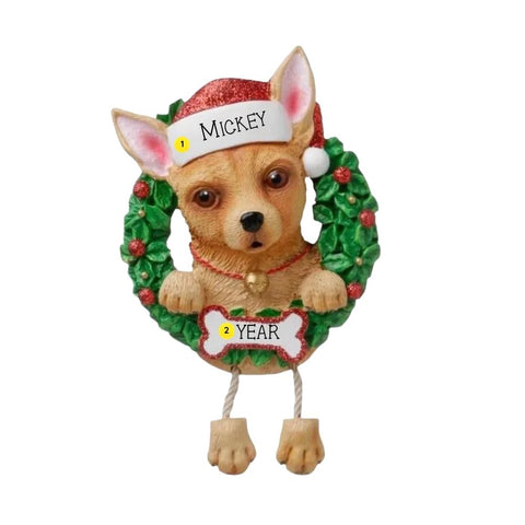 Personalized Chihuahua ornament with a tan dog in a Santa hat peeking through a green wreath with space for a name and year.