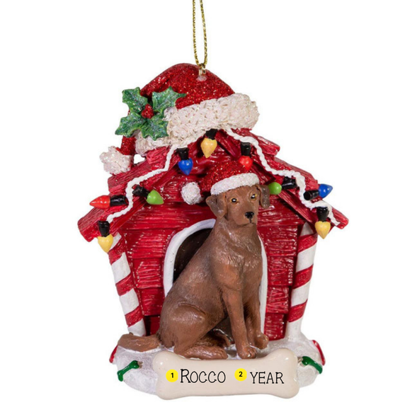 Personalized Chocolate Labrador Retriever dog house ornament with the example name Rocco and year on the bone-shaped plaque.