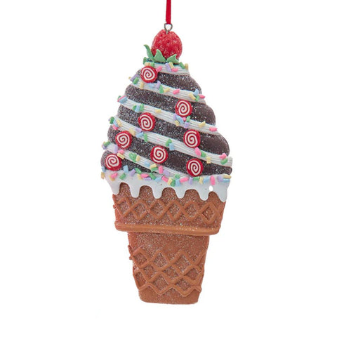 Ice cream cone ornament with chocolate swirled ice cream, peppermint candies, colorful sprinkles, white icing, and a strawberry on top.