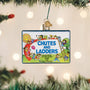 Chutes and Ladders game board ornament hanging on a Christmas tree.