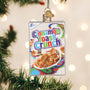 Cinnamon Toast Crunch cereal box ornament on a Christmas tree with lights in the background