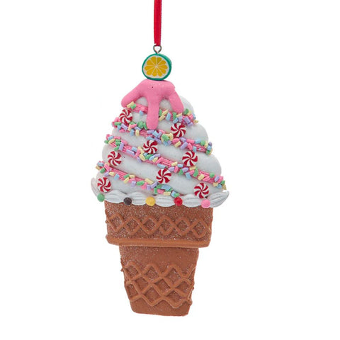 Ice cream cone ornament with pink and white swirled ice cream, peppermint candies, colorful sprinkles, white icing, and a citrus slice on top.
