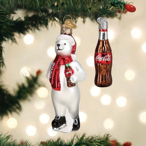 Christmas ornament of a Coke polar bear with Coca-Cola bottle and another Coca-Cola bottle hanging from a tree.
